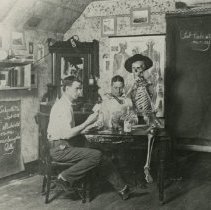 Students playing cards with skeleton 1909 Sep 16