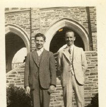 Men in suits in front of brick passage way 1932-1942