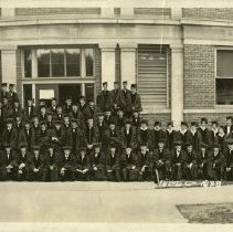KCOS graduates in front of building in caps and gowns 1928 Jun