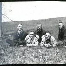 Howard Freeman and Friends Sitting in Field