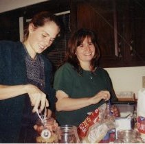 Rosemary Lyman and Juli Osmun Filling Jars