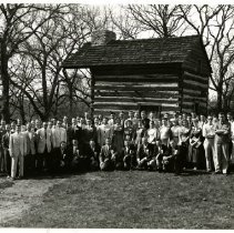 Group Portrait in Front of Still Family Cabin