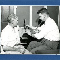 William Mulford Treats Patient at Gibbs Clinic