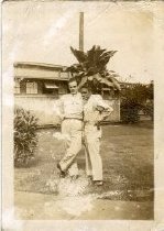 Man and Woman Posed in front of Building