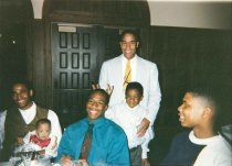 Group of Four Men and Two Children in Interior