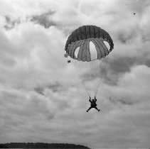 Man parachuting near Rosebur, ca 1950
