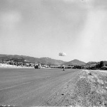 Man landing in parachute, Roseburg, ca 1950