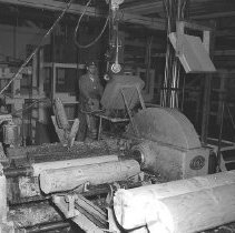Logs being peeled for plywood, Roseburg Lumber
