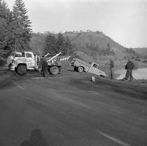 Tow truck removing pickup from river