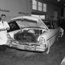 Engine work on Plymouth auto