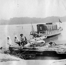 Narcissa Jewett and friends with vessel Washington in background