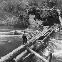 Splash dam releasing logs