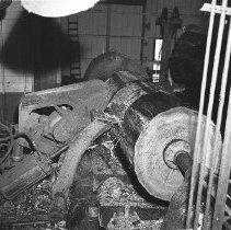 Debarking logs in sawmill