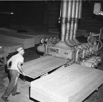 Operating hot press in plywood mill