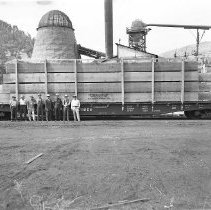 Loaded flatbed rail car at lumber mill