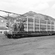 Plywood on flatbed railway car