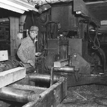 Running lumber through edger