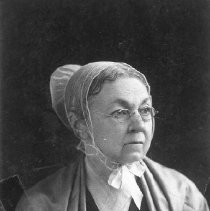 Mrs. E. H. Davis with 100 yr. old dress