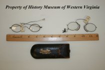 Eyeglass case with two pairs of eyeglasses.