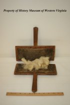 Wooden carder for processing wool.
