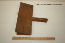 Wooden carder for processing wool.