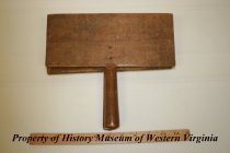 Wooden carder for processing wool.