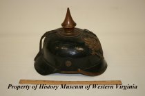 Side view of German WWI spiked helmet.
