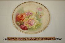 Dresden china plate painted with roses and gold trim.