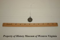 Commerative medal presented for a math award.