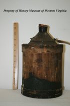Wooden and metal turpentine jug with cork.