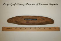 Bottom view of wooden shuttle.