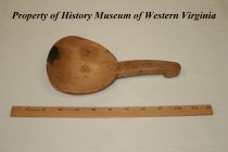 Wooden butter paddle.