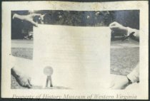 Two people holding diploma