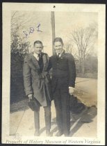 J. D. L. and other man