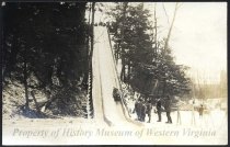 Hill with people sledding