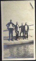 Four men on a sailboat