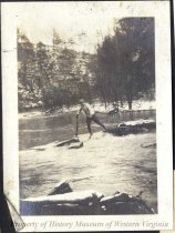 Man crossing stream