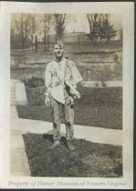 Man with torn and dirty clothes