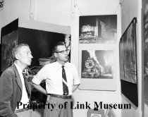 Dave Morgan And George Thom Looking At The Exhibit