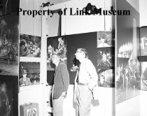 Dave morgan And George Thom Look At Exhibit