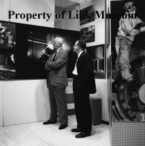 R. H. Smith And Link Look At The Exhibition