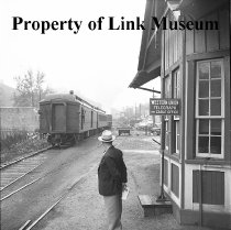 Individuals Standing Watching Train 202 Leave Lansing