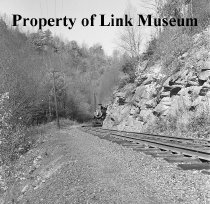 Engine 382, Train No. 201 Appearing Behind A Rock Out Cropping