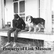 Corky On Porch Of B. F. Pope's House Wrapping Cords