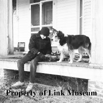 Cordy On Porch Of B. F. Pope's House Wrapping Cords