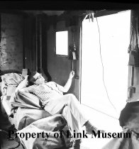 Tom Garver Lounges On Sacks Of Mail