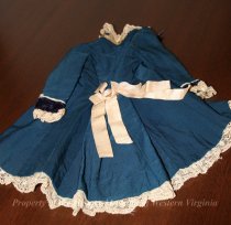 Rear View Of Toy Doll Overcoat