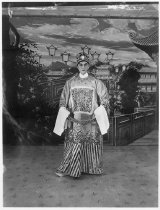 Actor of young male roles posing in a high official robe