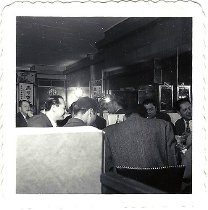 A candid photo of men dining at the Golden Dragon restaurant, 1949-1972