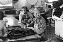 Two women in a Smart Parts garment factory , 1979-1982